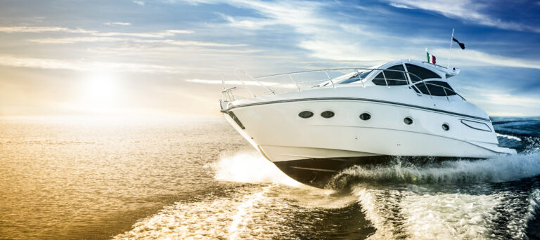 Luxurious motor boat sailing the sea at dawn